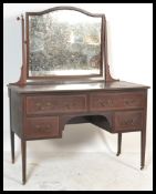 An Edwardian inlaid kneehole dressing table, swing