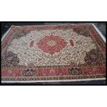 A large Persian floor carpet Keshan rug having a b