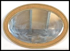 An early 20th Century Edwardian oval wall mirror h