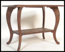 A 20th Century carved wooden hardwood Chinese tabl