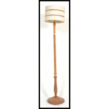 A 20th Century standard lamp raised on a round bas