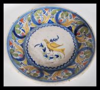 An 18th Century Delft polychrome charger plate dep