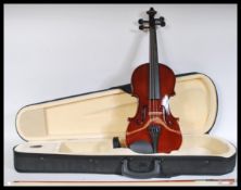 A contemporary student 3/4 violin with a horsehair