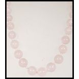 A rose quartz beaded necklace having round beads w