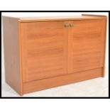 A retro 20th Century teak wood low sideboard enter