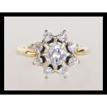 An 18ct gold 1.3 carat diamond cluster ring having