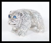 A sterling silver novelty miniature figurine of an