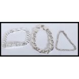 A selection of silver bracelets to include a flat