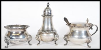 A set of three hallmarked silver cruets by Harrods