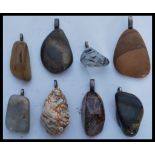 A selection of eight precious stone pendants to in
