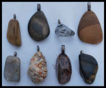 A selection of eight precious stone pendants to in