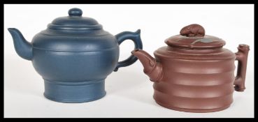 Two Chinese Yixing terracotta teapots comprising o