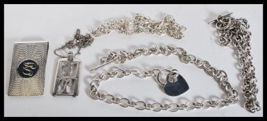 A selection of silver necklaces to include two cha