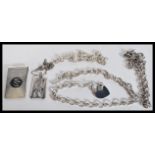 A selection of silver necklaces to include two cha