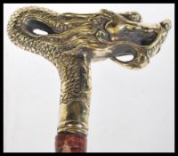 A bamboo walking stick having a brass handle in th