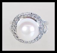 A sterling silver dress ring having a central fres