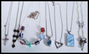 A selection of silver necklaces to include a neckl