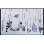 A selection of silver necklaces to include a neckl