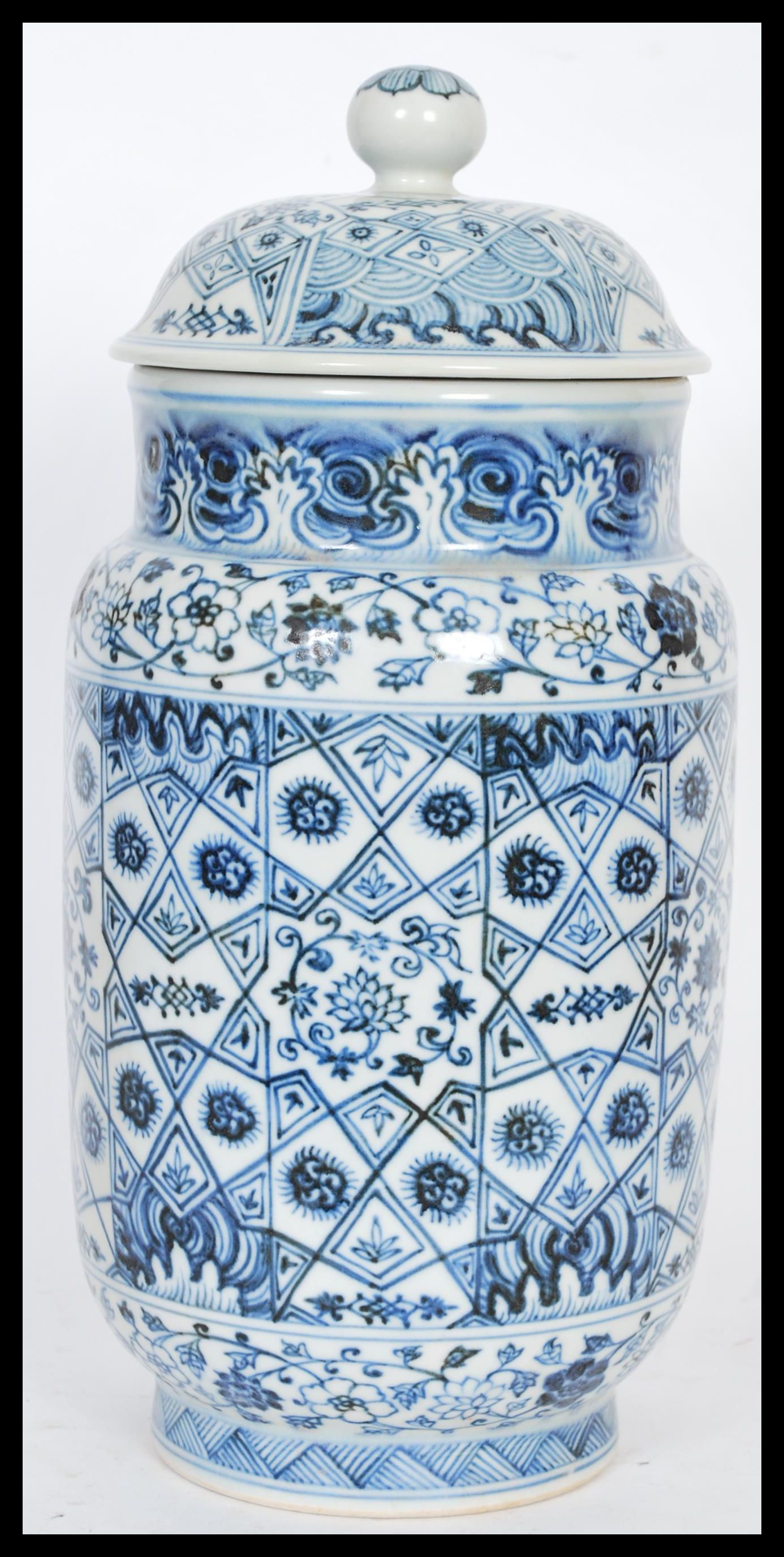 A Chinese hand painted blue and white ceramic vase