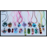 A selection of art glass pendants of different col