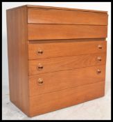 A retro 20th Century teak wood chest of six gradua