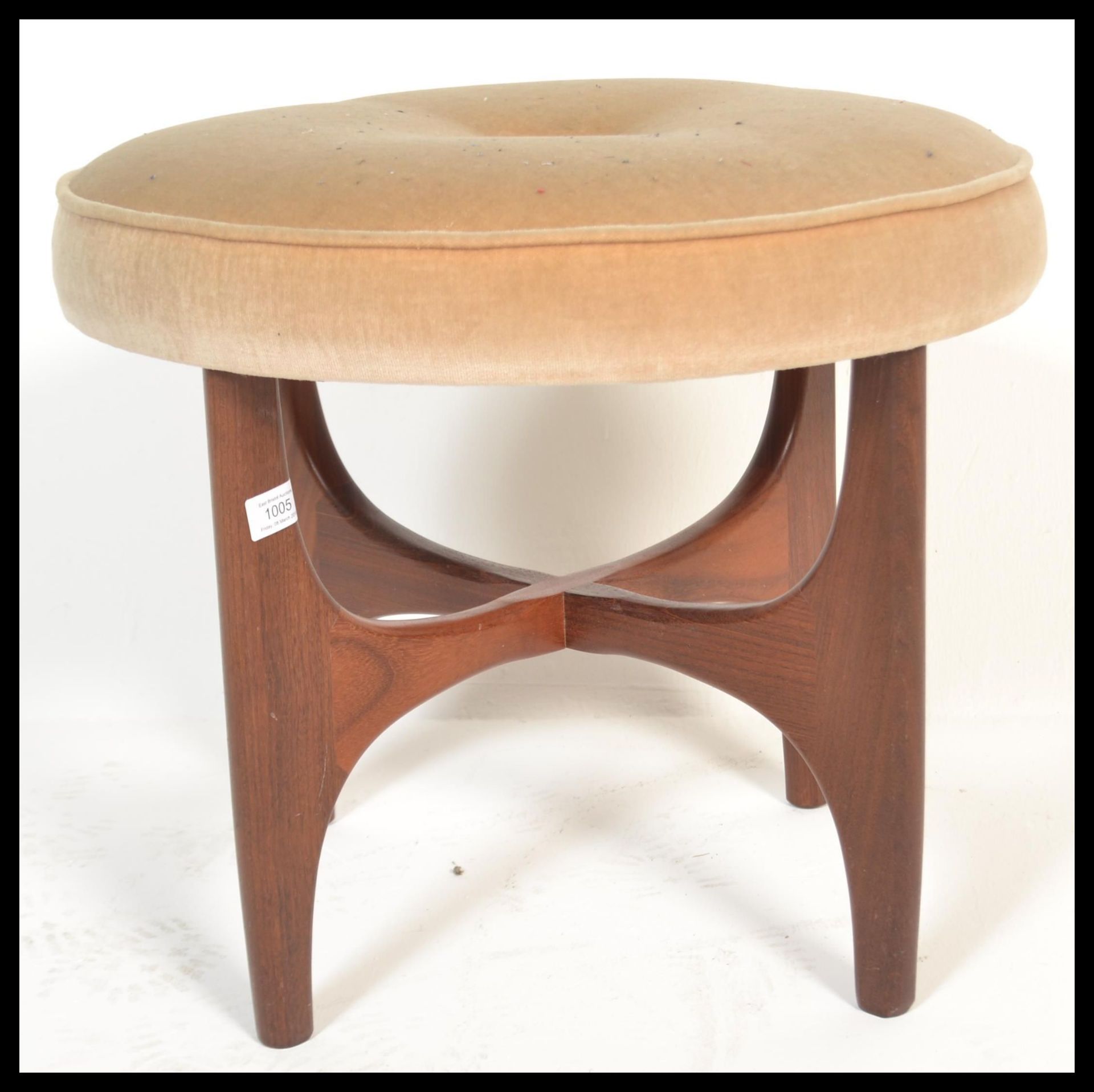A retro 20th century teak wood circular G-Plan dressing table stool raised on teak wood x-cross base