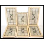 A set of early 20th century painted pine leaded and stained glass windows. Painted wooden