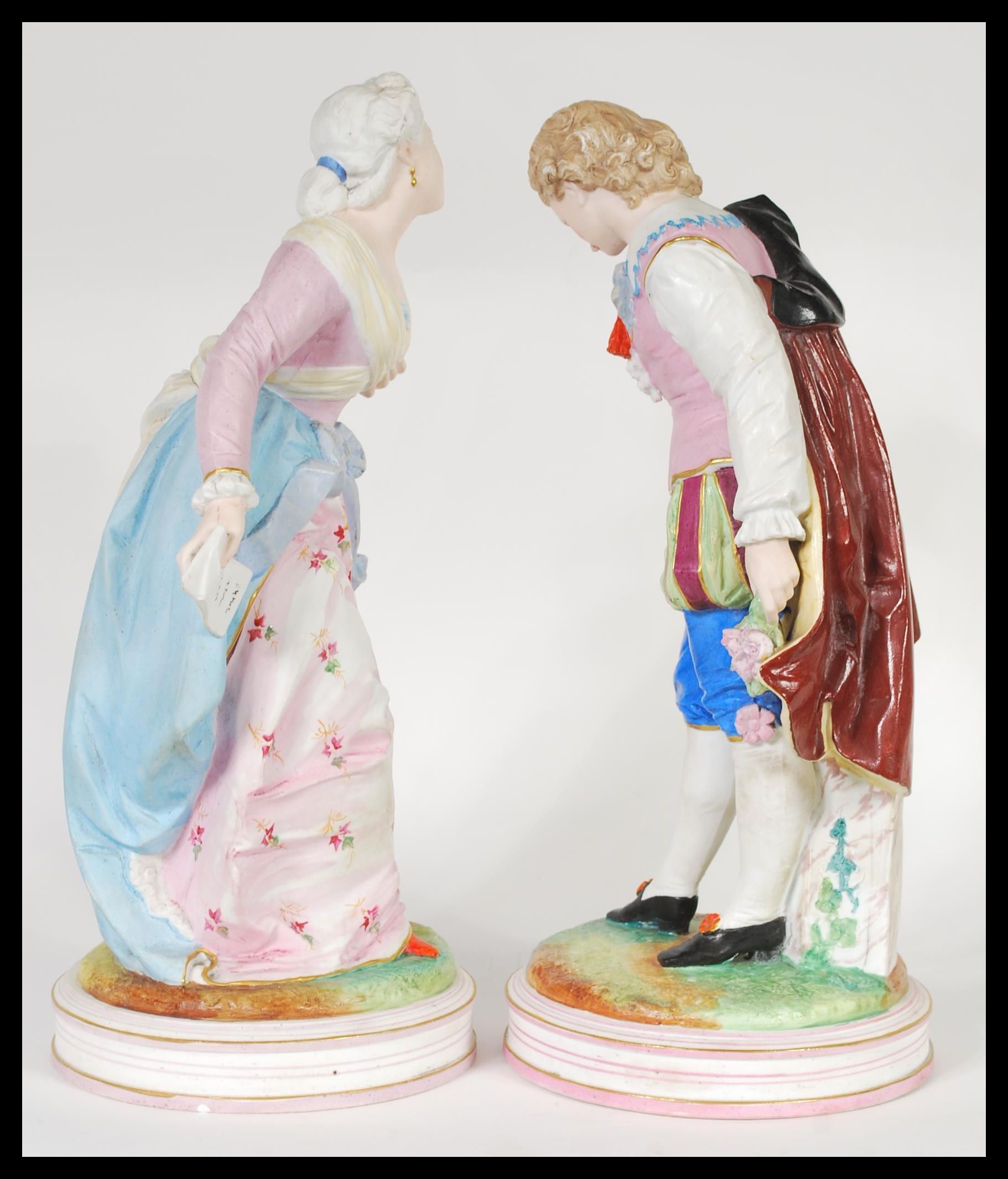 A pair of early 20th Century French Continental Bisque ware figurines depicting a courting couple. - Image 4 of 7