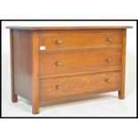 An early 20th Century Art Deco vintage tiger oak chest of drawers. The bank of three straight