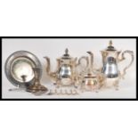 A collection of silver plate wares to include a 20th Century tea service consisting of coffee pot,