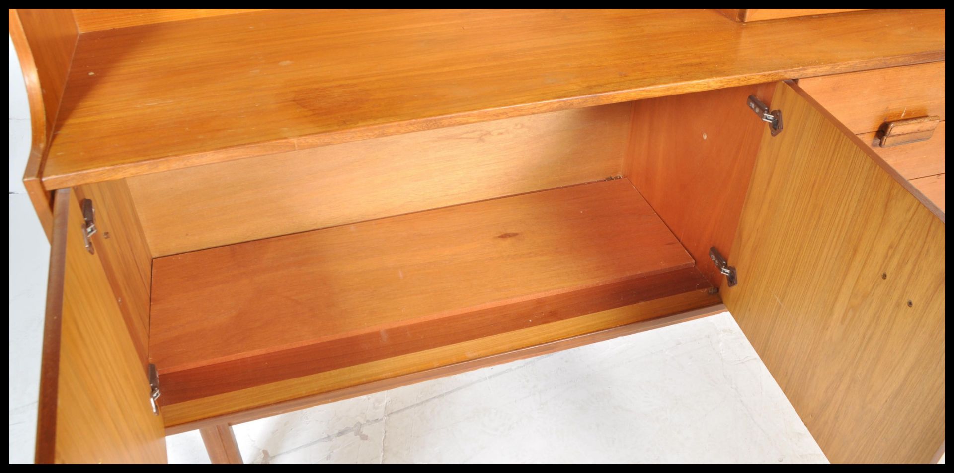A retro 20th Century teak wood highboard sideboard credenza by Alfred Cox having an arrangement of - Image 5 of 6