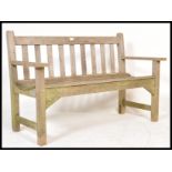 A vintage  country teak wood R.A. Lister of Dursley two seater garden bench having ladder backrest