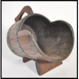 A 19th Century Victorian coal scuttle in the form of a coopered barrel having wooden body with