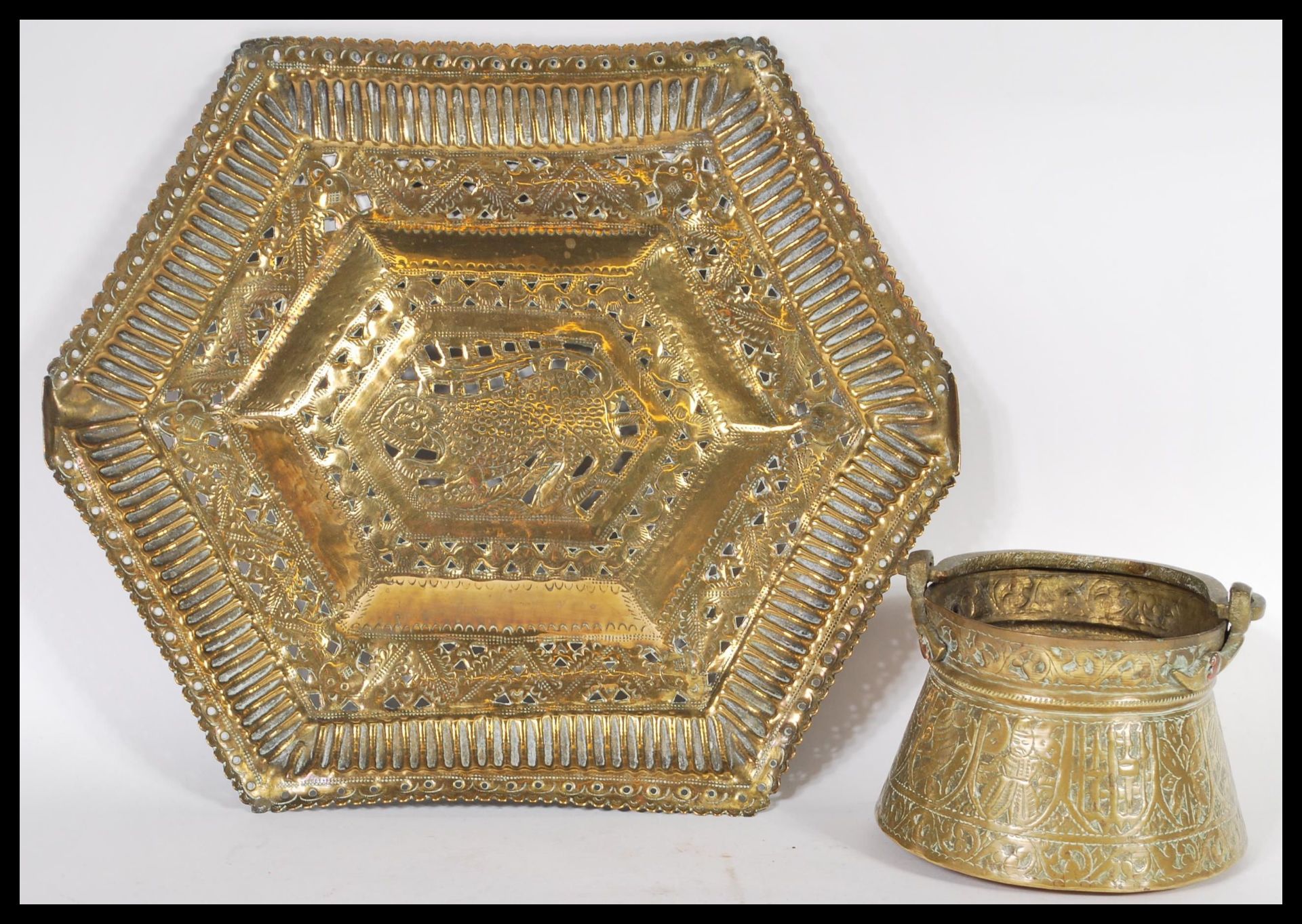 Two examples of early 20th Century Middle Eastern Persian Islamic brass to include a charger tray