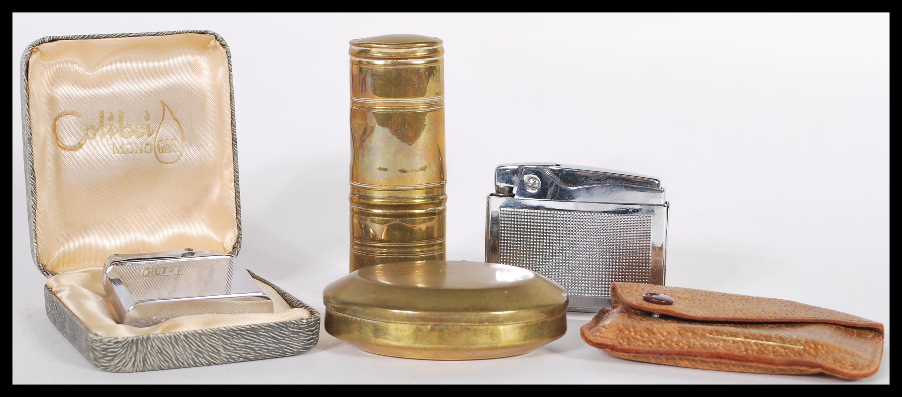 A group of smoking related items to include a Georgian 18th Century brass snuff box, a Ronson