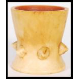 A 19th Century Ivory inverted conical egg cup, the lower half having a series of six pointed