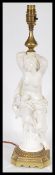 A 19th century Victorian table lamp centerpiece  having a white glazed nude figurine in classical