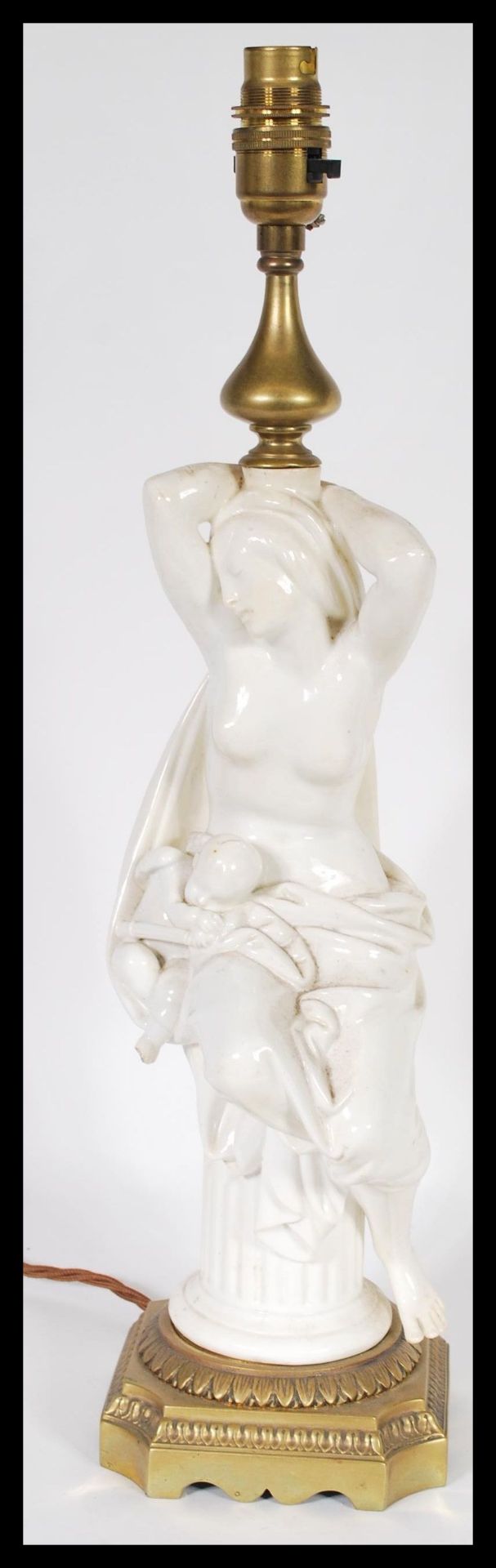 A 19th century Victorian table lamp centerpiece  having a white glazed nude figurine in classical