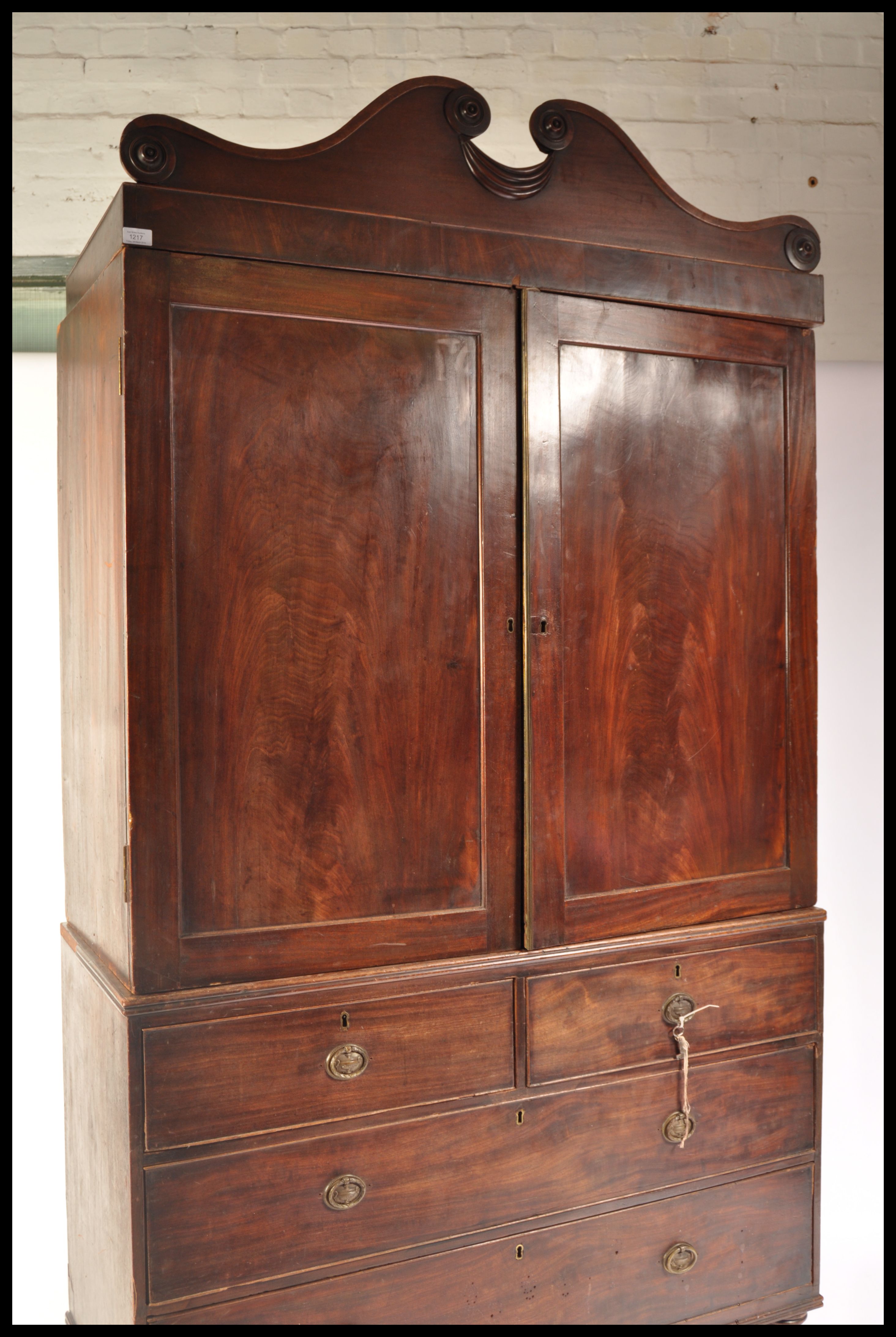 A 19th Century Regency mahogany linen press raised on a two over two chest base with twin cupboard - Image 4 of 7