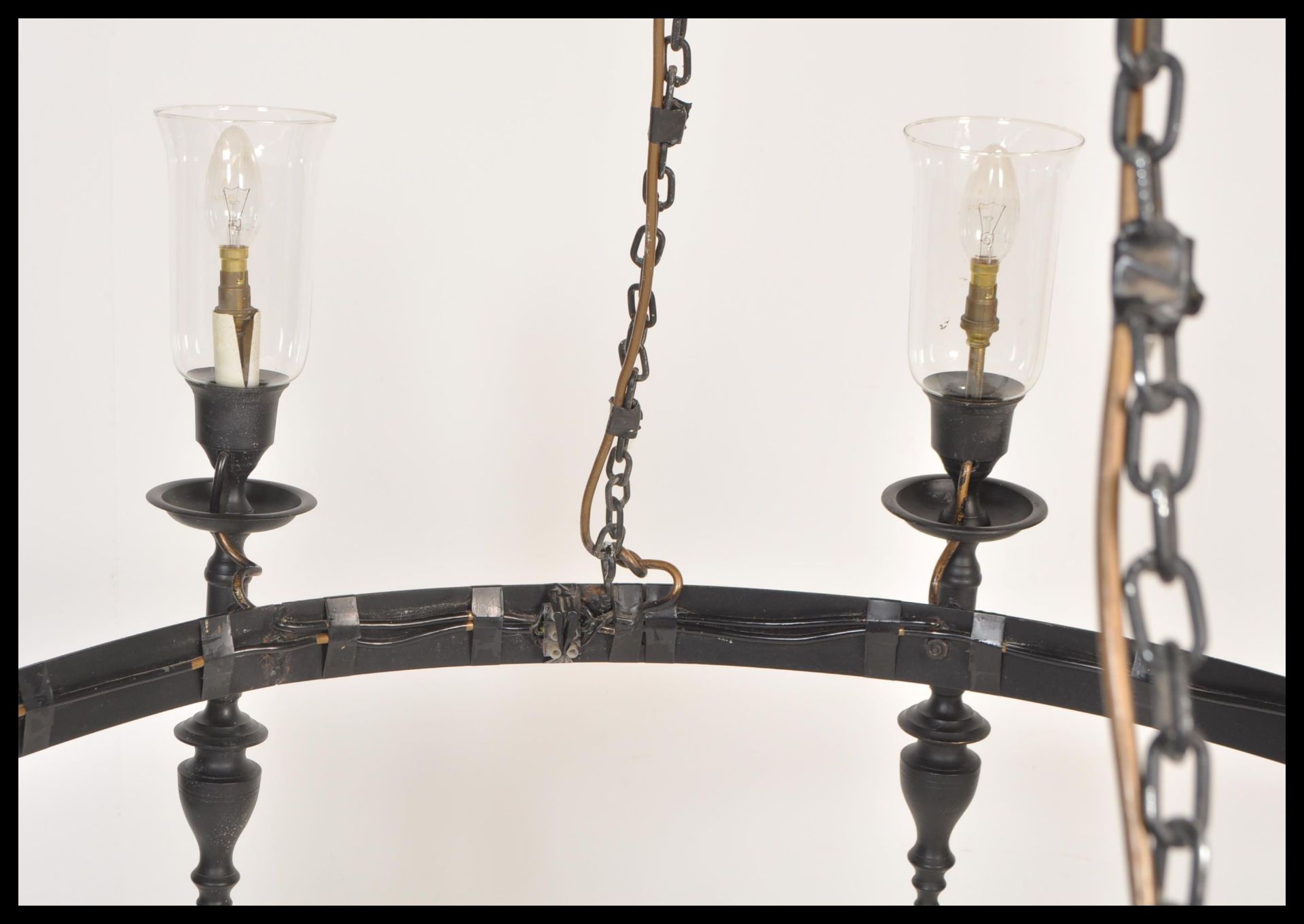 A large 20th Century ebonised iron ceiling light chandelier having eight ebonised sconces with - Image 4 of 7