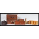 A selection of 20th Century treen ware items to include a desk box with two drawers having brass