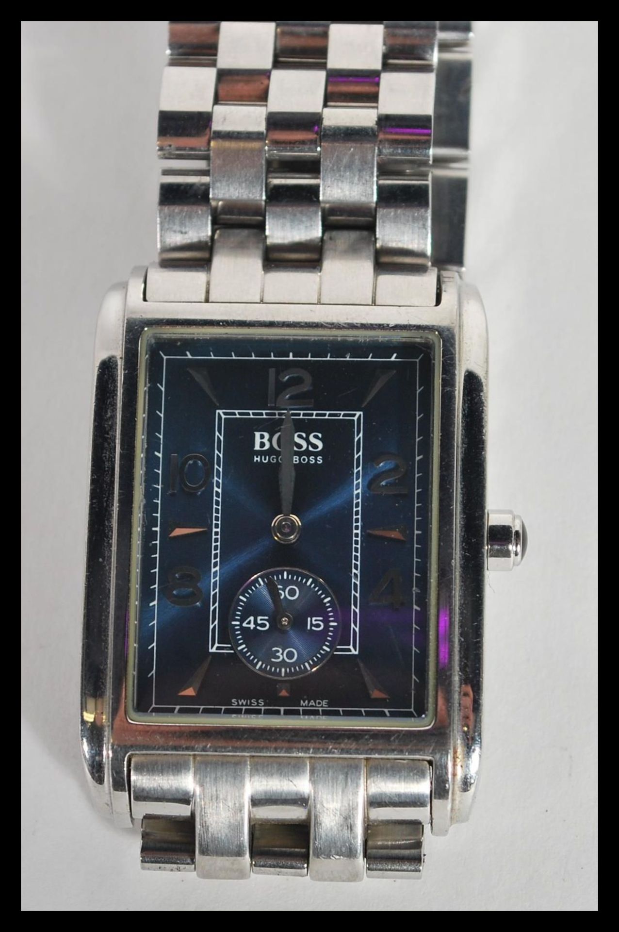 A contemporary Designer Hugo Boss tank style watch having blue dial with faceted hands and