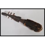 Tribal Art - a vintage 20th Century African Adungu-type string instrument fitted with three strings,