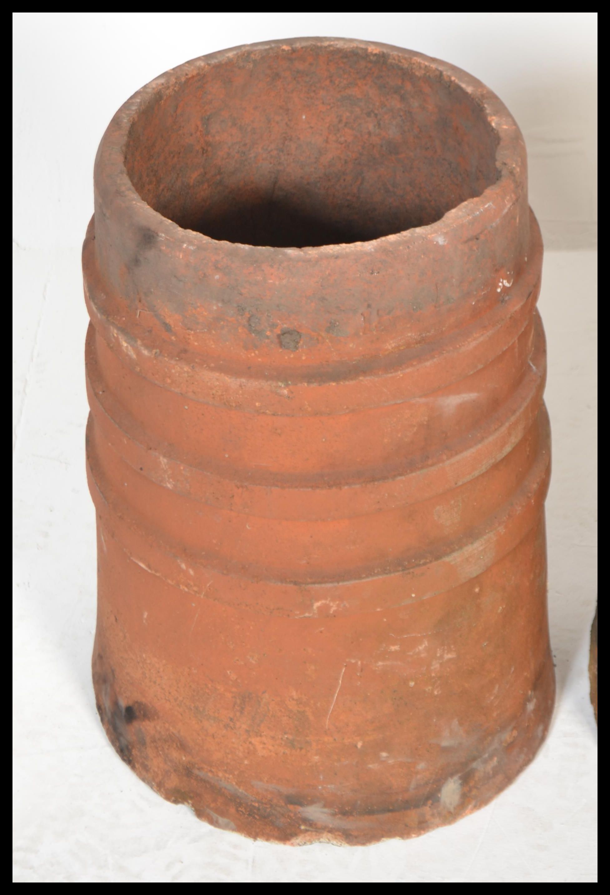 A group of three 20th Century reclaimed stoneware chimney pots of matching cylindrical form. - Image 3 of 5