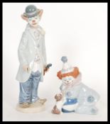 Two vintage Lladro ceramic figurines depicting clowns to include a clown with violin 5472 and