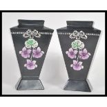 A pair of Shelley early 20th Century Art Nouveau vases having hand painted violet flowers and ribbon