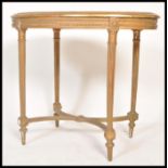 A 19th Century French gilt ormolu wooden table of octagonal form raised on reeded column legs with X