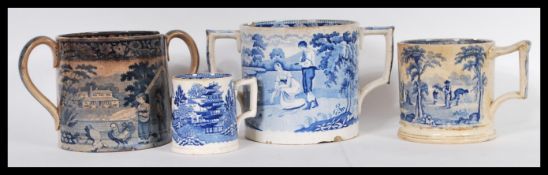 A collection of 18th and 19th Century blue and white Staffordshire twin handled loving cups and