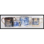 A collection of 18th and 19th Century blue and white Staffordshire twin handled loving cups and