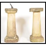 A pair of 20th Century matching well weathered garden stone sundial and bird bath raised on tall